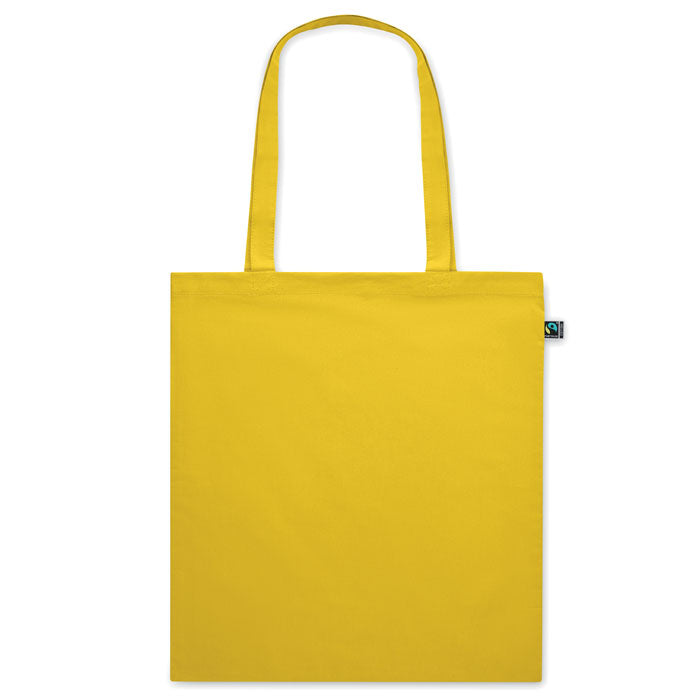 Bolsa amarilla OSOLE COLOUR de algodón 140gr/m² con asas largas, ecológica y personalizable. Ideal para eventos y tiendas.
