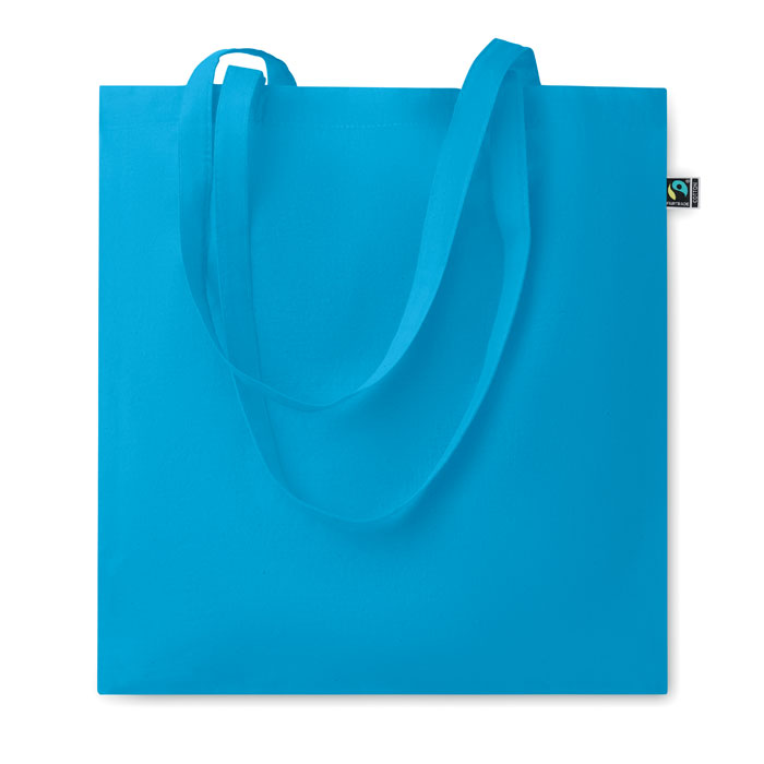 OSOLE COLOUR - Bolsa de algodón de comercio justo con asas largas en color azul celeste, ideal para ferias, tiendas y regalos sostenibles.