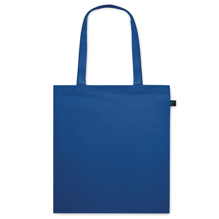 Bolsa de tela azul marino OSOLE COLOUR con etiqueta de comercio justo y asas largas. Ideal para ferias, tiendas y regalos ecológicos.
