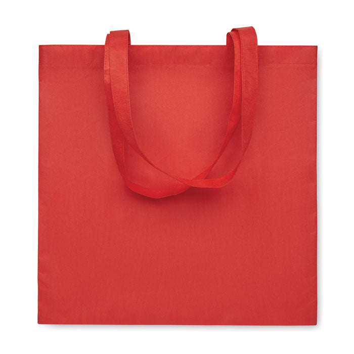 KAIMANI - Bolsa non woven RPET 80 gr/m2 asas largas en color rojo, perfecta como bolsa promocional ecológica y reutilizable.