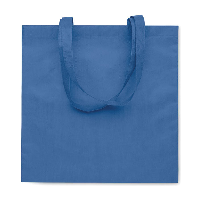 KAIMANI - Bolsa non woven RPET 80 gr/m2 asas largas en azul royal, reutilizable y perfecta para campañas de marketing ecológicas.
