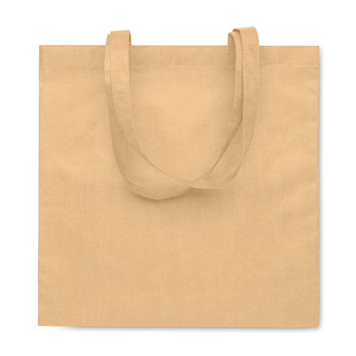 KAIMANI - Bolsa non woven RPET 80 gr/m2 asas largas en color beige, ideal para personalización en campañas ecológicas y sostenibles.