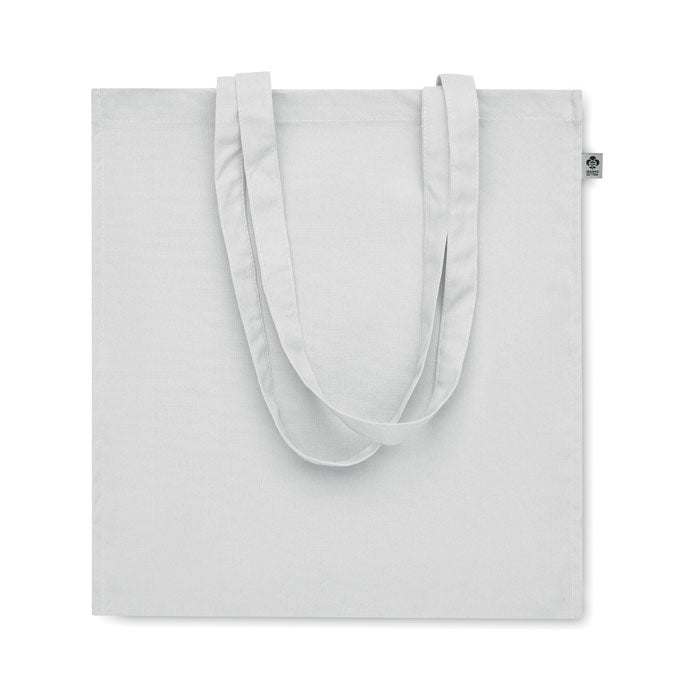 Vista trasera de la bolsa blanca BENTE COLOUR de algodón orgánico, ideal para campañas promocionales sostenibles.