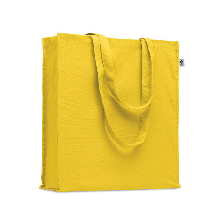 Bolsa amarilla BENTE COLOUR de algodón orgánico 220 gr con asas largas y fuelle, ideal como bolsa de compras ecológica y colorida.