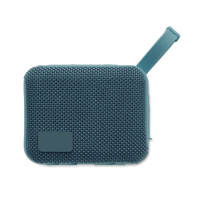Vista superior de un altavoz inalámbrico de 5 W en color azul, con acabado texturizado y asa para colgar.
