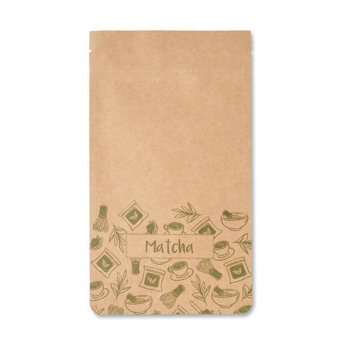 MATCHA - Té matcha en polvo 10 g en un paquete de papel marrón con ilustraciones de tazas y utensilios de té.