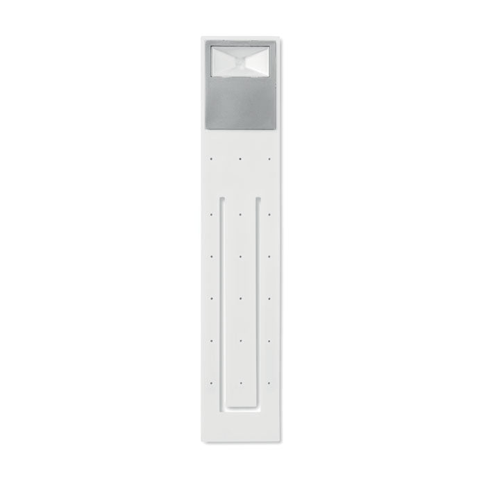Vista frontal de una luz de lectura LED flexible en color blanco, ideal para usar como punto de libro, con diseño moderno.