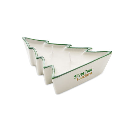 Vela navideña en soporte de porcelana elegante