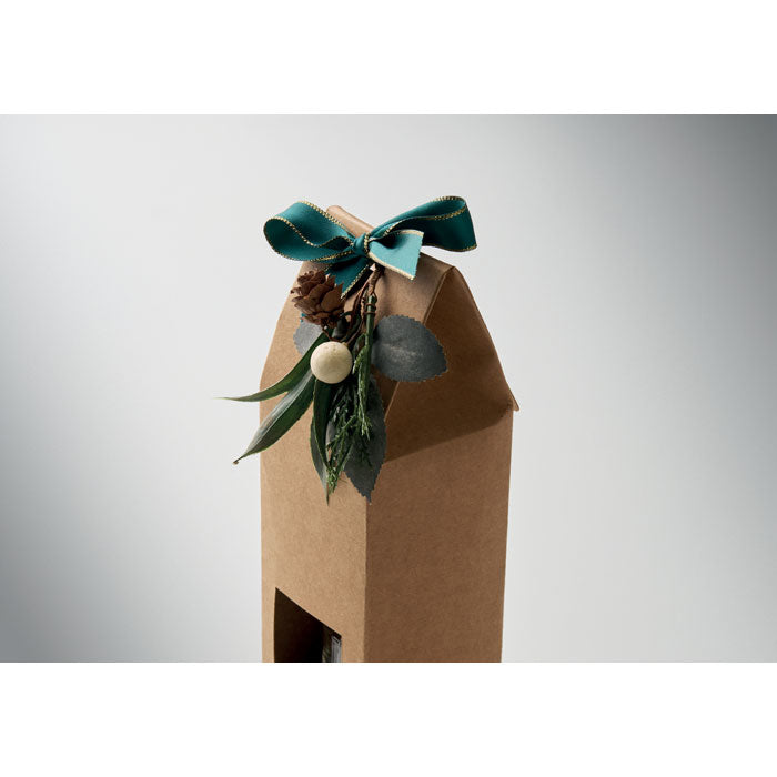 GINGLE - Set vela y difusor de vainilla en presentación de caja kraft decorada con un lazo azul y detalles de plantas.