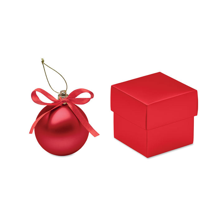 BELLES - Bola de Navidad en caja, bola roja con cinta y caja de regalo al lado, decoración navideña elegante.