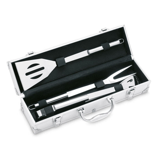 Maletín de aluminio abierto con 3 utensilios de barbacoa