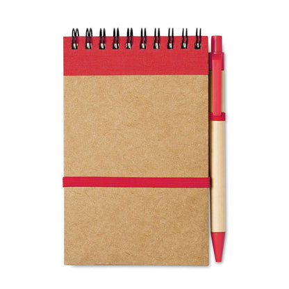 Libreta de bolsillo tamaño A6 con detalles en rojo y bolígrafo