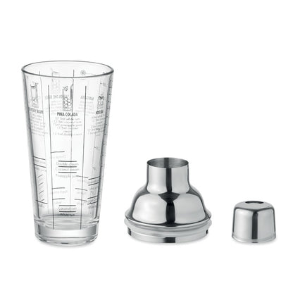 Vaso de cristal de coctelera con recetas escritas