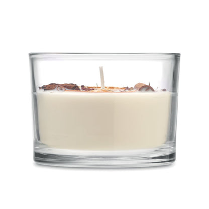 Vista lateral de vela de cera vegetal en tarro de cristal