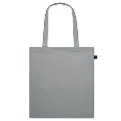 Totebag gris de algodón con asas largas y etiqueta de certificado Fairtrade cosida en el lateral