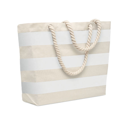 Bolsa de playa grande con fuelle color natural con rayas negras y con cordones gordos 
