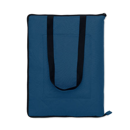 Manta de picnic azul con asa de transporte negra y plegable con cremallera
