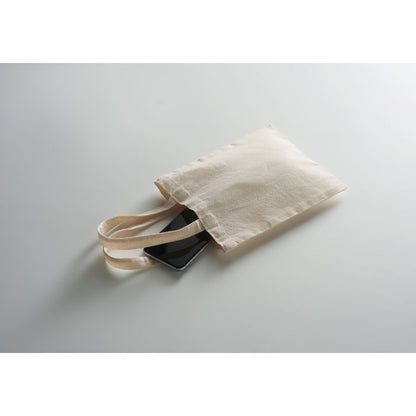 Bolsa de algodón tumbada sobre fondo gris