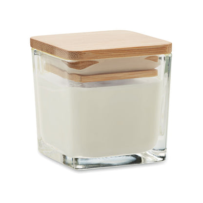 Vela cuadrada blanca con envase de vidrio y tapa de madera