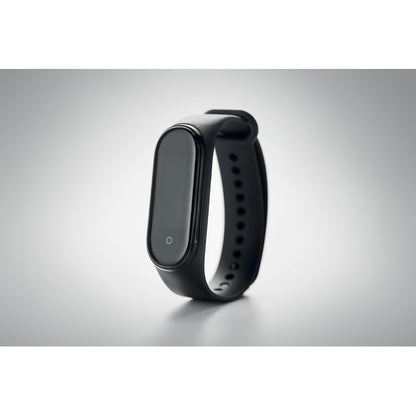 Pulsera de actividad negra apagada sobre fondo gris