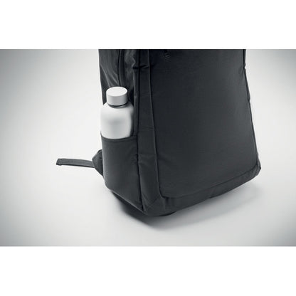 Botella de metal blanca dentro de bolsillo lateral de mochila trolley de viaje