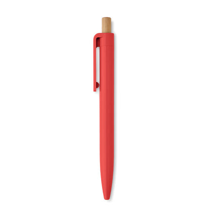 Detalle de pulsador de madera de bolígrafo rojo de plástico