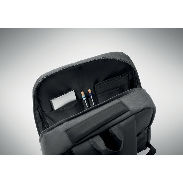Interior view of AKRAOS - Mochila para portátil de 15", featuring organized pockets for laptop, tablet, and stationery.