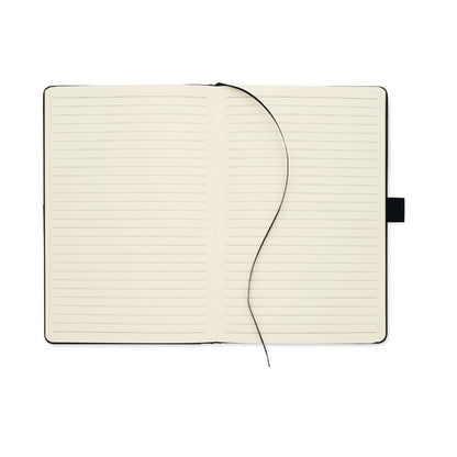 Cuaderno abierto con hojas a rayas y cinta marcapáginas