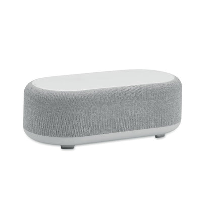 Altavoz gris multifunción rectangular con reloj digital y cargador inalámbrico integrado
