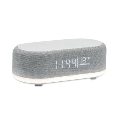 Altavoz gris con base ancha, luz ambiental superior y botones táctiles