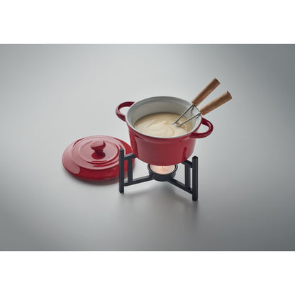 Fondue con queso y con tenedores dentro sobre un fondo gris neutro