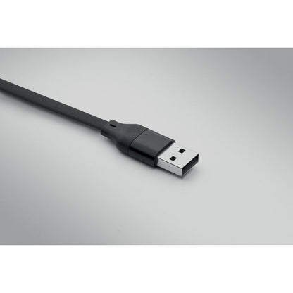 cable USB de carga negro sobre fondo gris