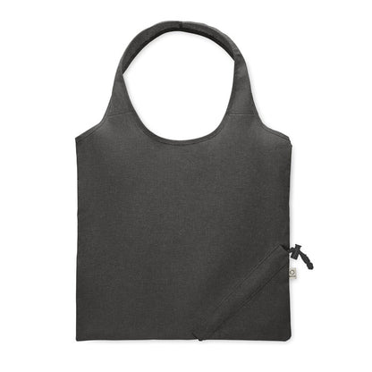 Parte trasera de bolsa de algodón  negra plegable con sistema de plegado con mosquetón en la esquina inferior