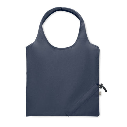Parte trasera de bolsa de algodón azul marino plegable con sistema de plegado con mosquetón en la esquina inferior