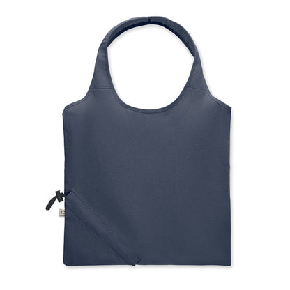 Parte frontal de bolsa de algodón azul marino con sistema de plegado con mosquetón en la esquina inferior