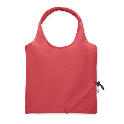 Parte trasera de bolsa de algodón roja plegable con sistema de plegado con mosquetón en la esquina inferior