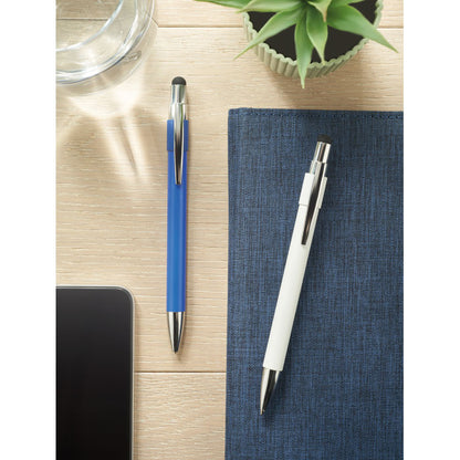 Bolígrafo azul y bolígrafo blanco con antistress en mesa de oficina con cuadernos