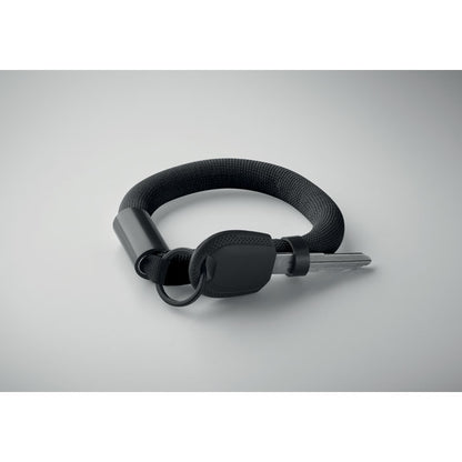 Vista superior de Llavero pulsera flotante Negra sobre fondo gris