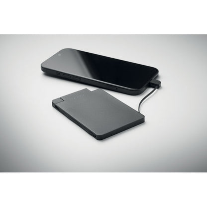 Batería externa negra conectada a un teléfono móvil