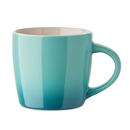 Taza de diseño redondeado de efecto degradado color turquesa