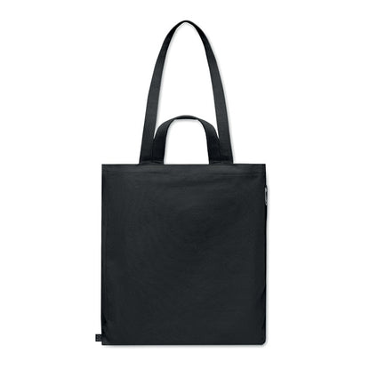 Vista delantera de bolsa de algodón negra con asas largas y cortas y etiqueta de tejido recilado cosida en el lateral