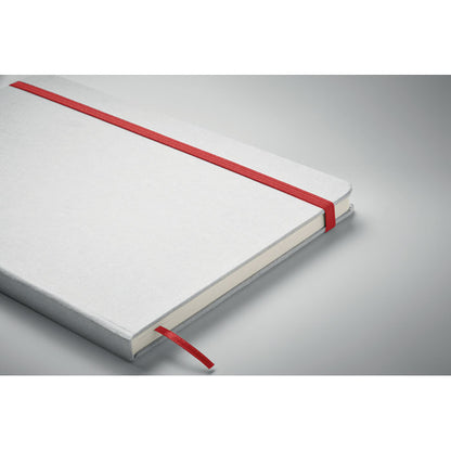 Vista lateral de libreta blanca con cierre goma roja