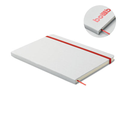 Libreta abierta con hojas a la vista y marcapáginas roja
