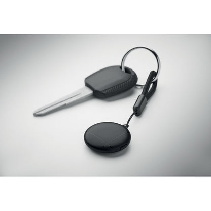Vista superior de llavero negro localizador con llave de coche