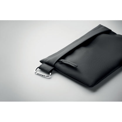 Vista superior de bolsa organizadora con cremallera sobre fondo gris