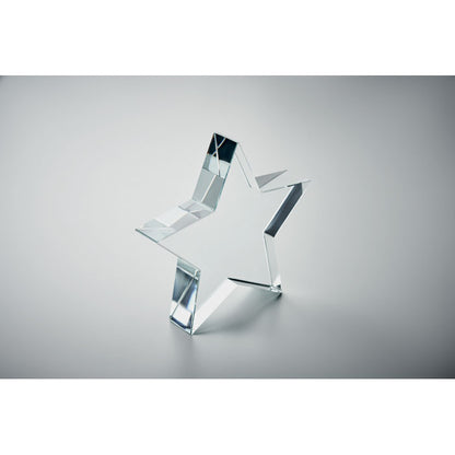 figura de estrella de vidrio con fondo gris