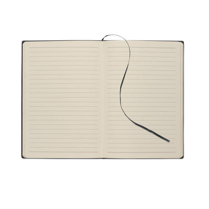 Libreta abierta con hojas rayadas y cinta marcapáginas