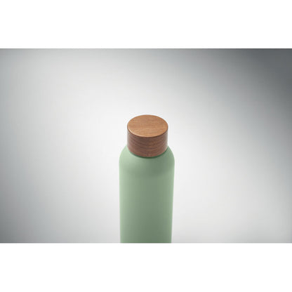 Vista superior de botella verde pastel de acero ecológico con tapón de madera