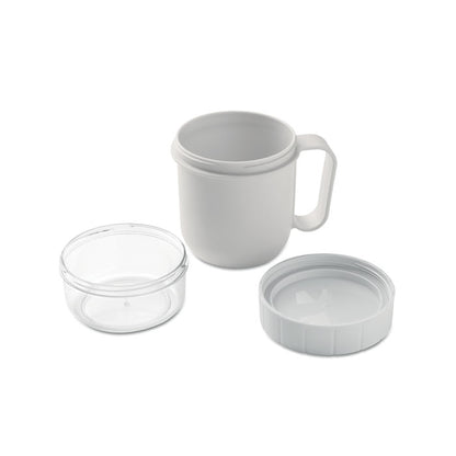 Vista superior de taza blanca con tapa y contenedor de alimentos