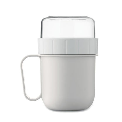 Vista lateral de Taza blanca con recipiente para alimentos en tapa